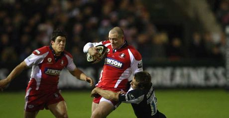Gloucester centre Mike Tindall is tackled by Newcastle fly-half Jonny Wilkinson