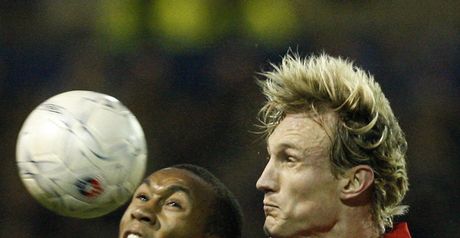 Heads I win: Hyypia and Andrew challenge for the ball