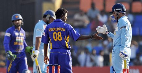 Muralitharan is congratulated after taking his record-equalling 502nd ODI wicket