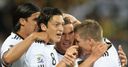Podolski: Mobbed after opening the scoring