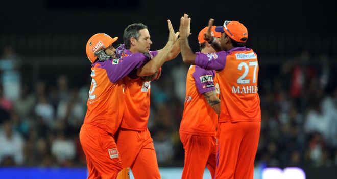 Hodge celebrates a wicket with teammates