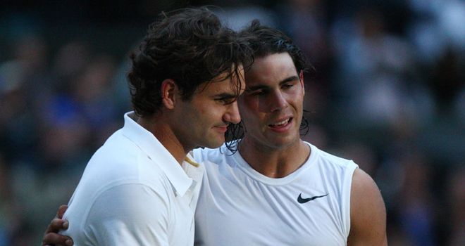 Federer and Nadal embrace after a titanic battle in darkening skies