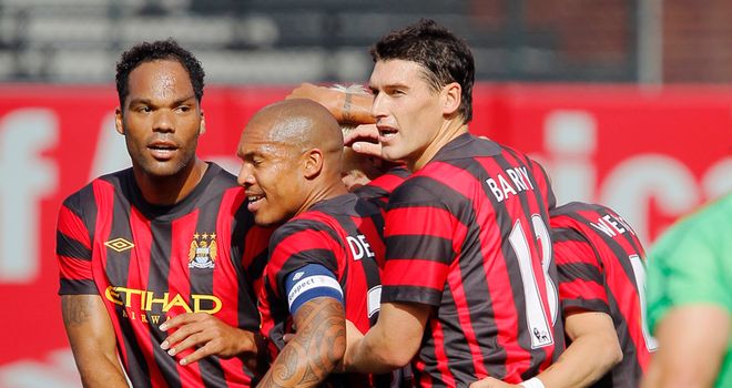 City players celebrate scoring against Club America