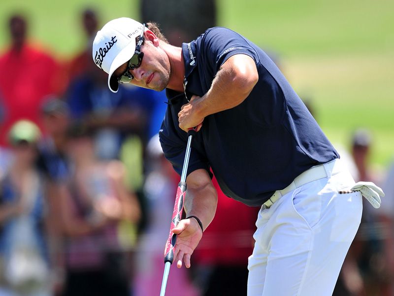 Adam Scott putts. It still looks strange to see him stroking the ball like that.