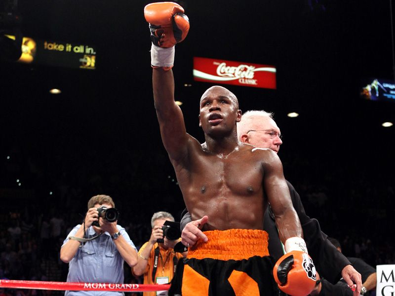 Floyd Mayweather Jr maintained his perfect record with a controversial fourth-round knockout of Victor Ortiz.
