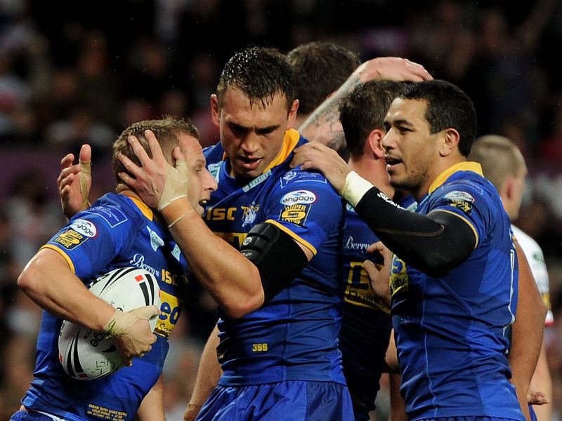 The little scrum-half is congratulated by his team-mates after crossing the line for a score that gave Leeds an 8-2 half-time lead.