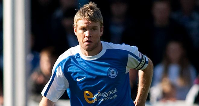 Grant McCann: Peterborough captain could be out for 10 weeks after suffering a knee injury