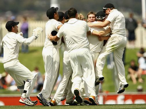NZ hero Doug Bracewell is mobbed.