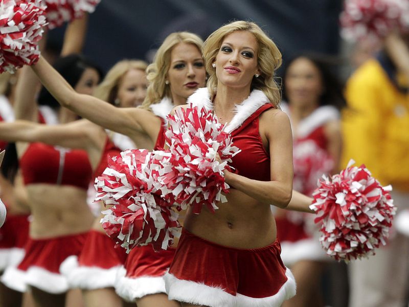 NFL cheerleaders get into the festive spirit - and outfits - for the holiday period.