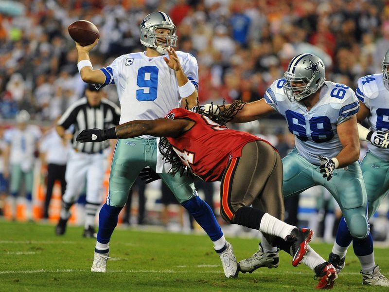 Tony Romo shook off his usual December slump to star in Dallas' whipping of Tampa Bay.