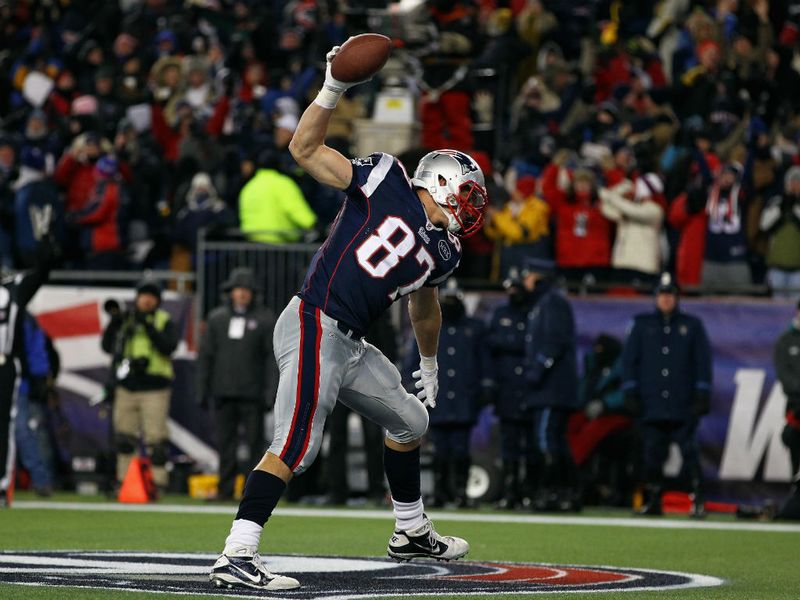 Things were not so close later on Saturday night as Rob Gronkowski tied a play-off record with three TD catches as the Patriots hammered the Broncos.