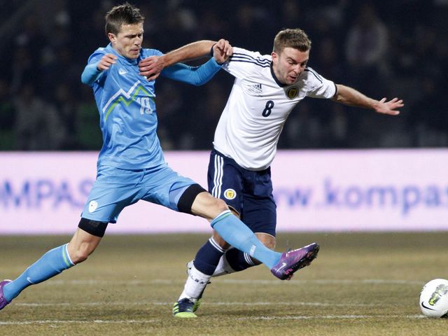 Ilicic and Morrison battle for the ball