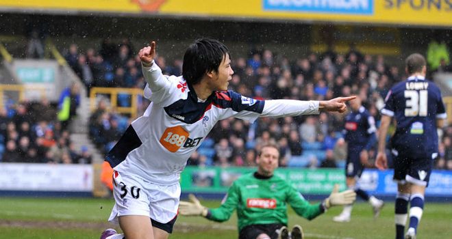 Ryo Miyaichi scores the opening goal of the game for Bolton at Millwall