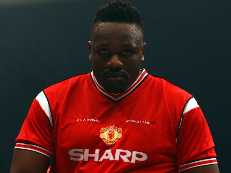 Chisora wore a Manchester United 1985 Cup final shirt under his robe
