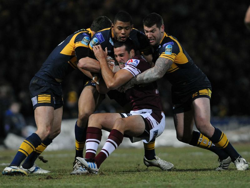 Michael Oldfield finds there's no way to get around the Rhinos, meaning Manly trailed 16-16 at the break.