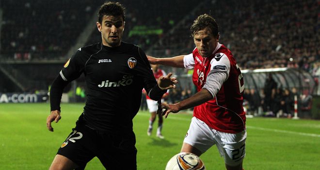 Tough battle: Brett Holman and Antonio Barragan vie for the ball in Holland