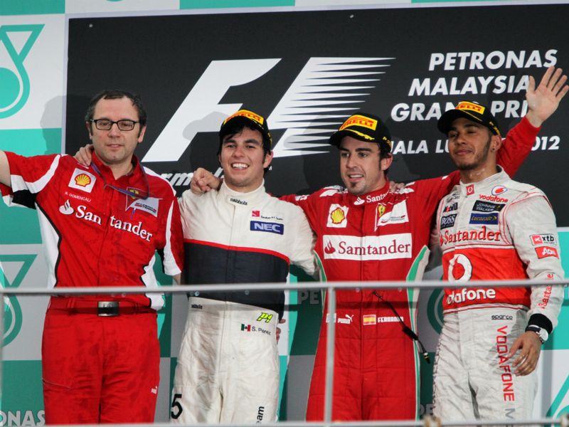 Stefano Domenicali joins Sergio Perez, Fernando Alonso and Lewis Hamilton on the podium