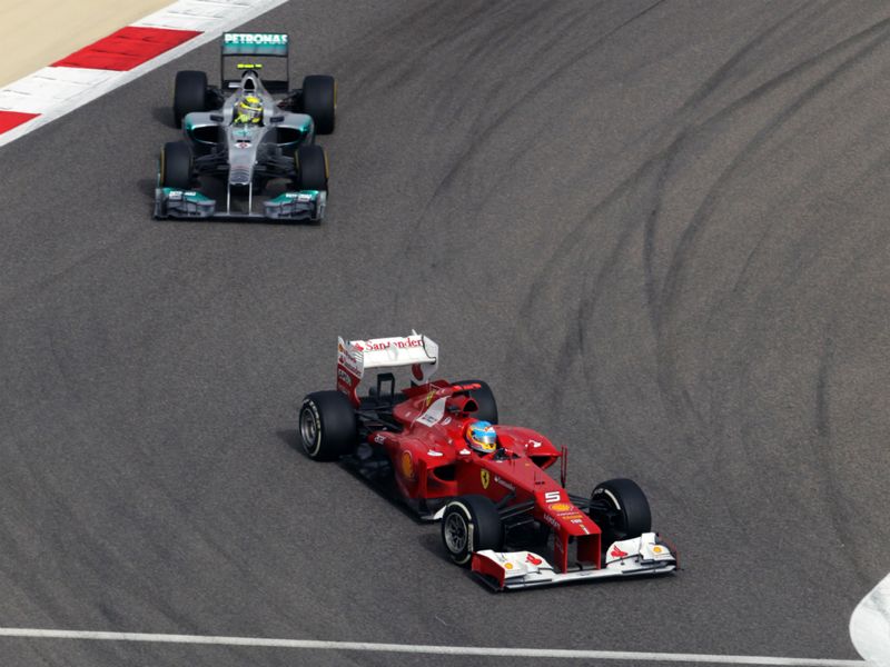 Fernando Alonso and Nico Rosberg battle