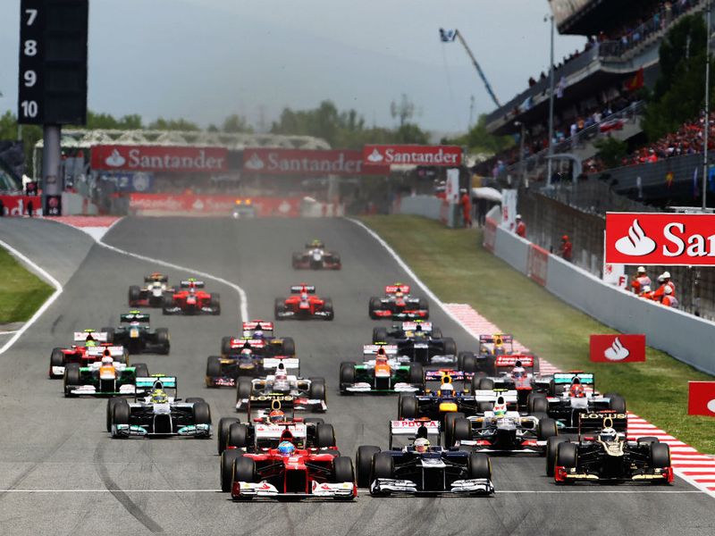The cars race to turn 1