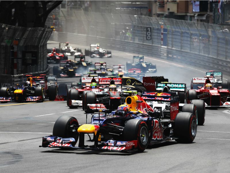 Mark Webber leads into turn 1