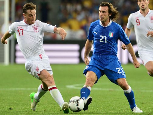 Parker tries to win the ball from Pirlo.