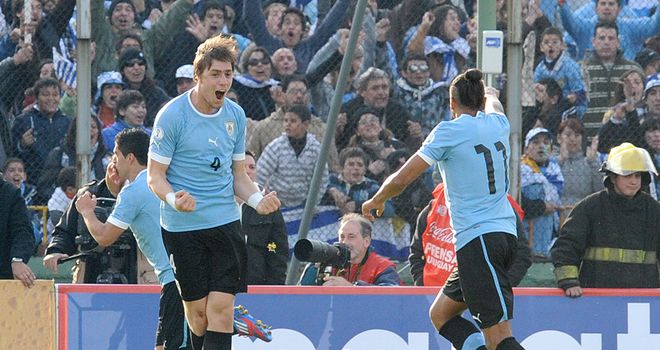 Sebastian Coates: The defender celebrates the Uruguayans opening goal