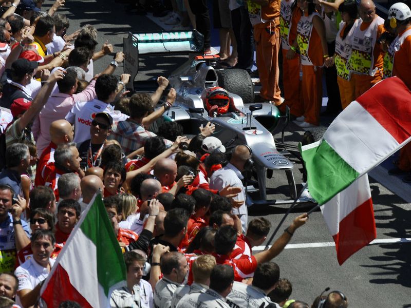 Schumacher is mobbed in parc ferme
