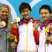 Ye Shiwen, Elizabeth Beisel and Xuanxu Li collect their medals.