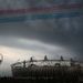Dark clouds have gathered over the stadium, but nothing will dampen the spirits of this London crowd, as the Red Arrows pass over the stadium