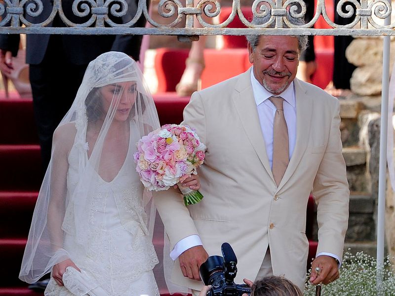 The blushing bride, Anna Ortiz arrives with her father (Angel Ortiz).