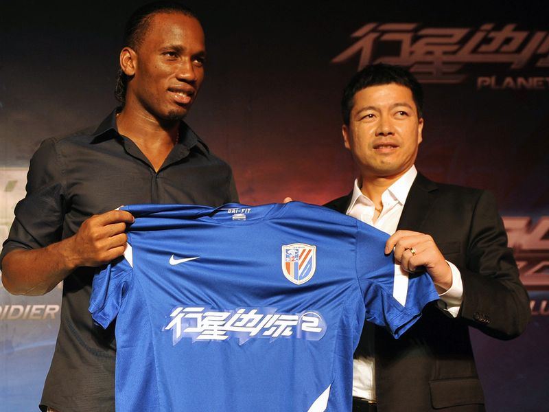 Drogba with the club's shirt