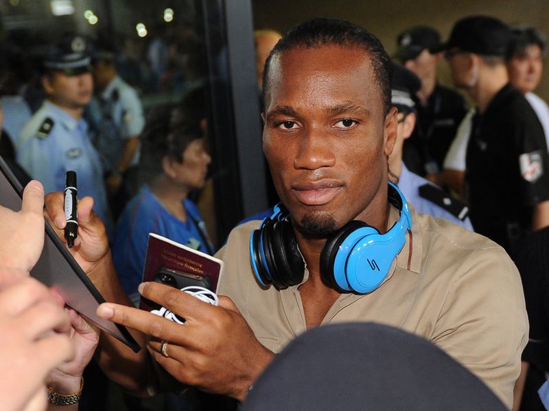 Drogba signs autographs