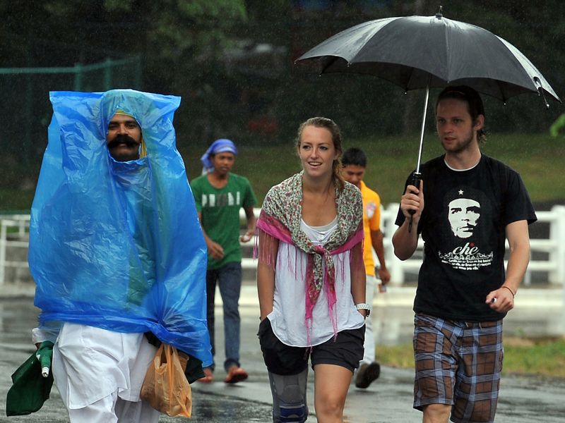 Fans arrived for the day's play, and so did the rain.