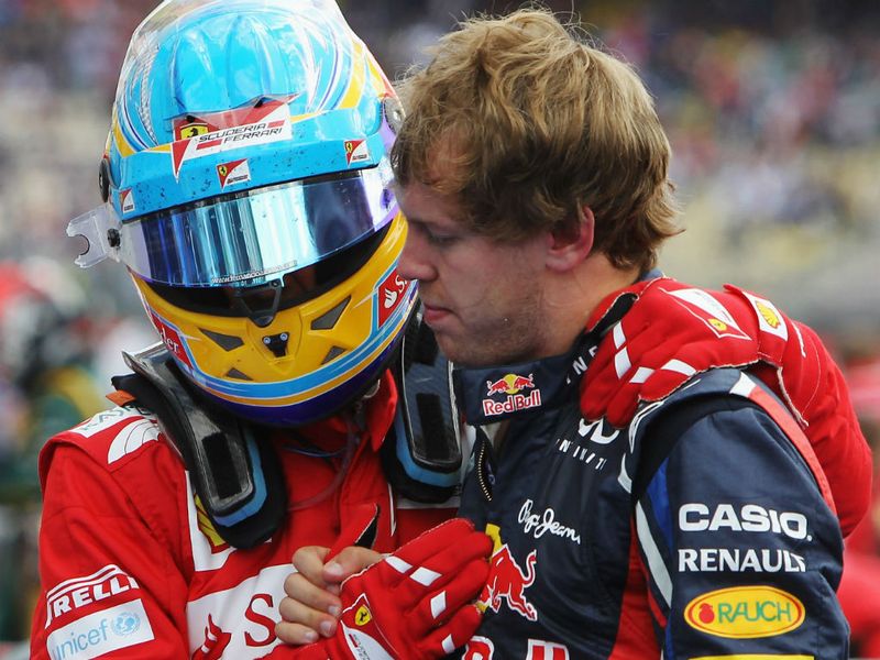 Fernando Alonso with second placed Sebastian Vettel