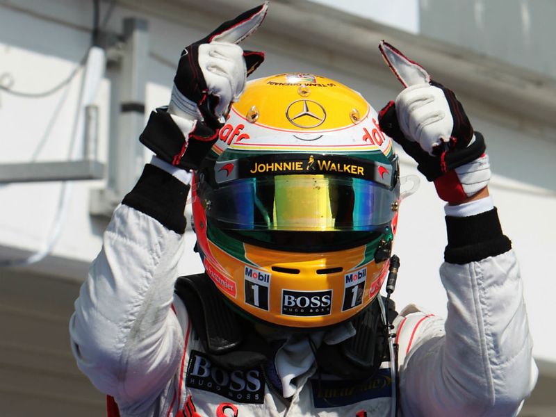 Lewis Hamilton celebrates the win