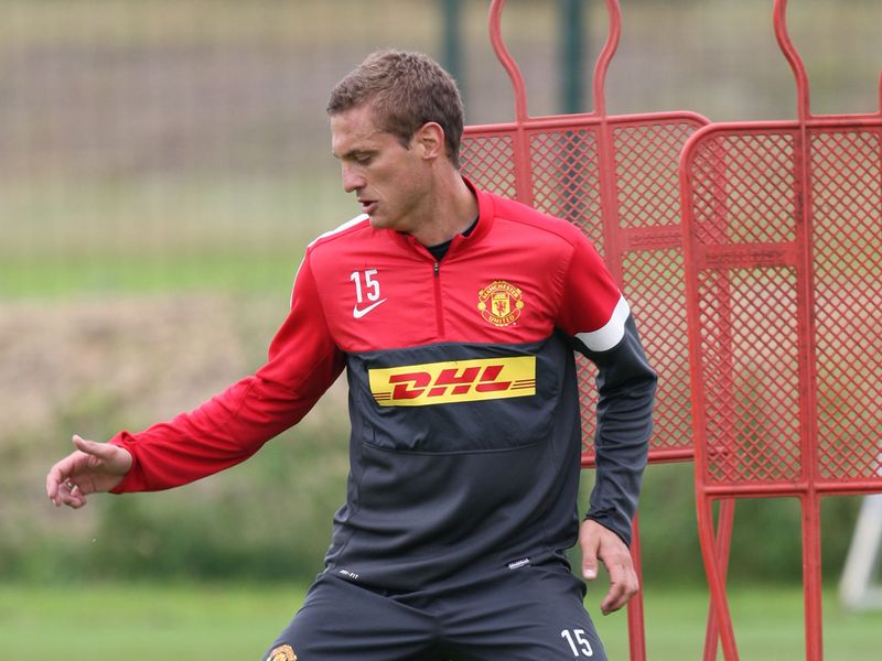 Nemanja Vidic looks at the ball