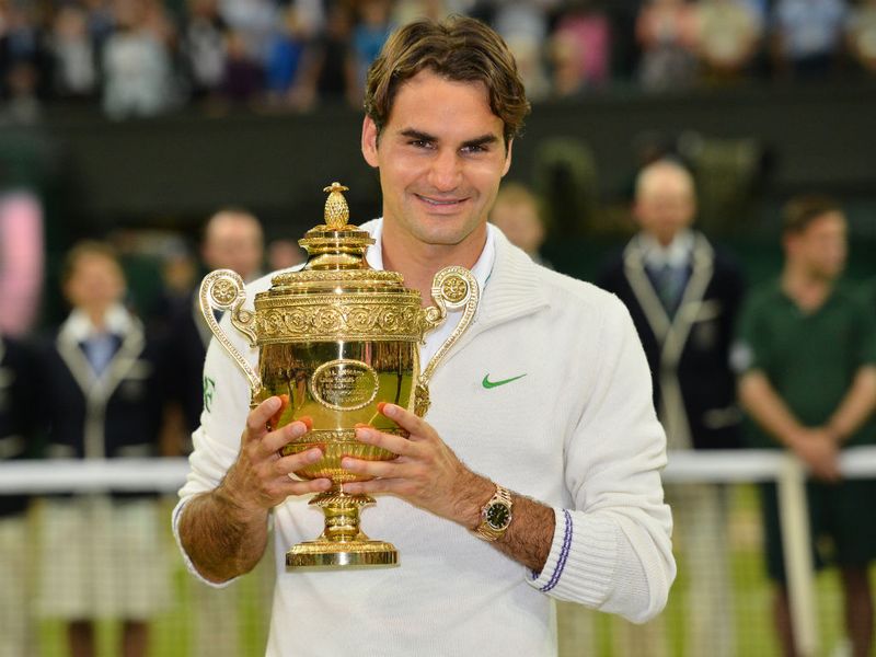 The Swiss champion was at times unplayable and receives the trophy for a record seventh time to equal Pete Sampras' record.