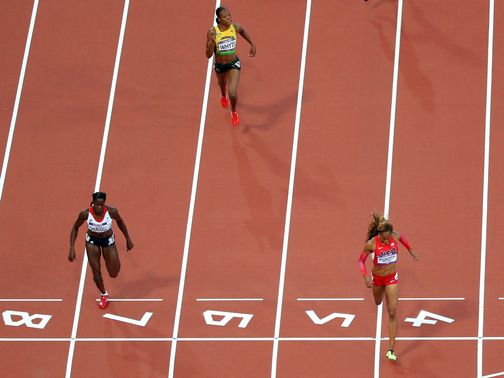 Sanya Richards-Ross (right) leads Ohuruogu across the finish line&nbsp;