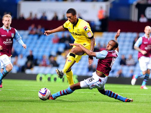 Liam Palmer is tackled by Fabian Delph