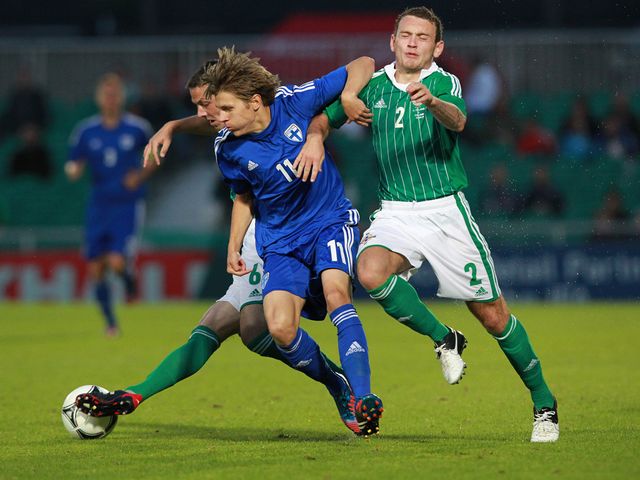Riku Riski and Lee Hodson battle for the ball