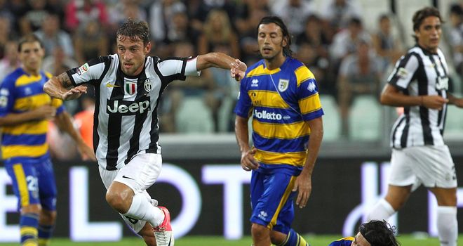 Claudio Marchisio shakes off a challenge