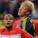 Spartak Moscow's Ari battles with former Liverpool man Dirk Kuyt of Fenerbahce, who cancelled out Emmanuel Emenike's opener.