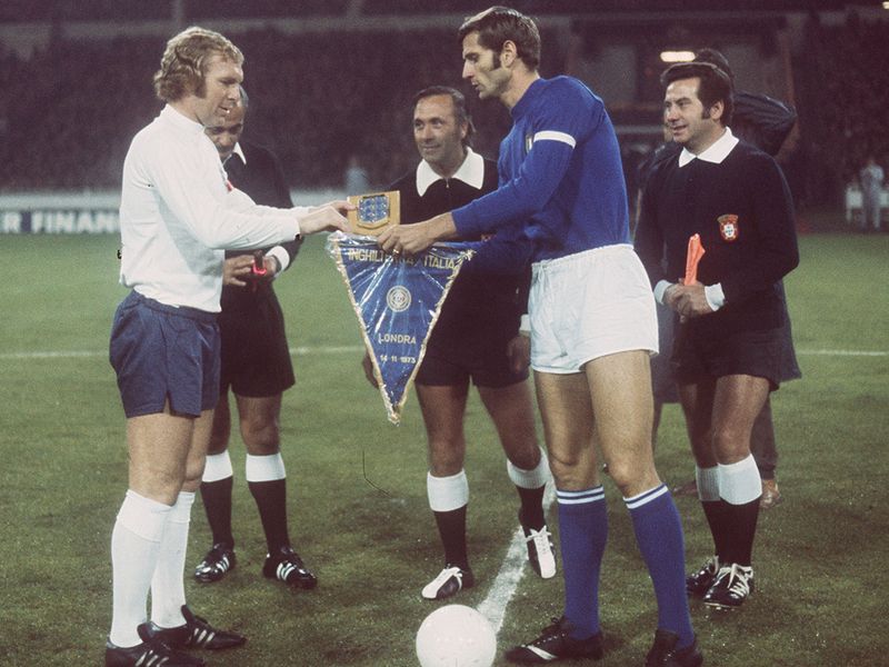 England captain Bobby Moore exchanges pennants with Italy counterpart Giacinto Facchetti before an international at Wembley in 1973