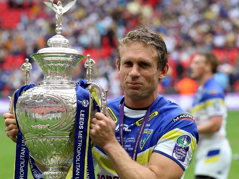 The outstanding Brett Hodgson gets his hands on the cup