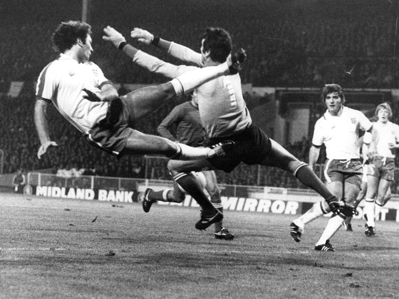 Ray Wilkins competes with Dino Zoff during a World Cup qualifier in 1977. England won the match 2-0 thanks to goals from Kevin Keegan and Trevor Brooking