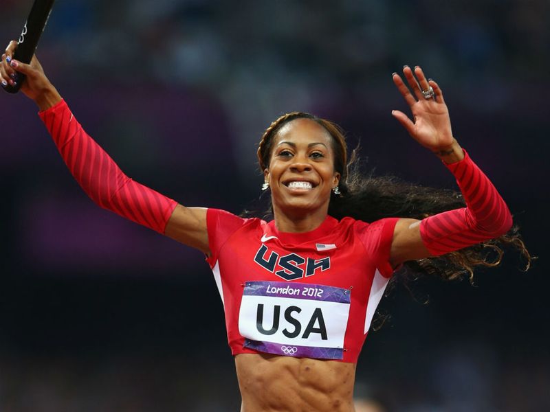 Sanya Richards-Ross crosses the finish line in the final Women's 4x400m Relay to confirm an easy win and a Gold medal for Team USA