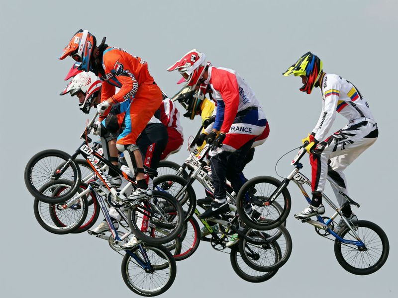 The field clear a jump in the men's BMX cycling semi-finals.