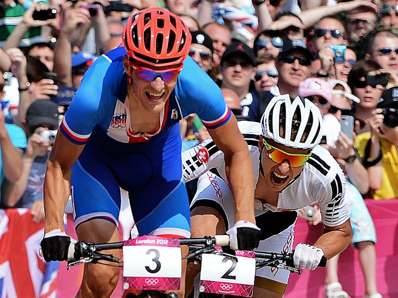 Going for Gold: Czech Republic's Jaroslav Kulhavy (left) sprints with Switzerland's Nino Schurter to win the men's cycling cross-country mountain bike race