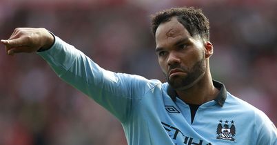 Joleon Lescott: Happy to stay at Manchester City and fight for his place