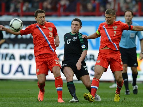 Corry Evans is the meat in a Russia sandwich